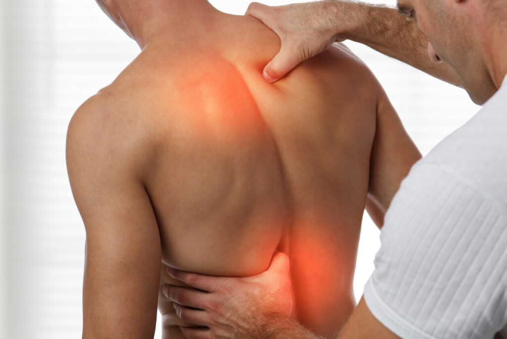 A male patient undergoing back decompression, a procedure aimed at relieving back pain.