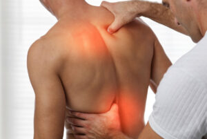 A male patient undergoing back decompression, a procedure aimed at relieving back pain.